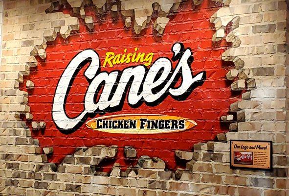 Inside the restaurant: Raising Cane's sign.