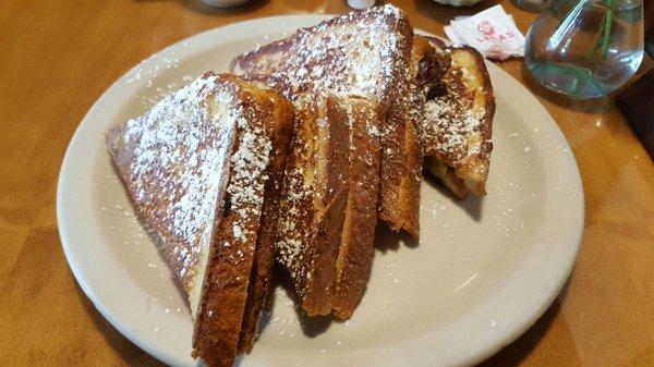 Stuffed French toast. Can't see the strawberrys and bananas because they are buried between each peice.. really good though..