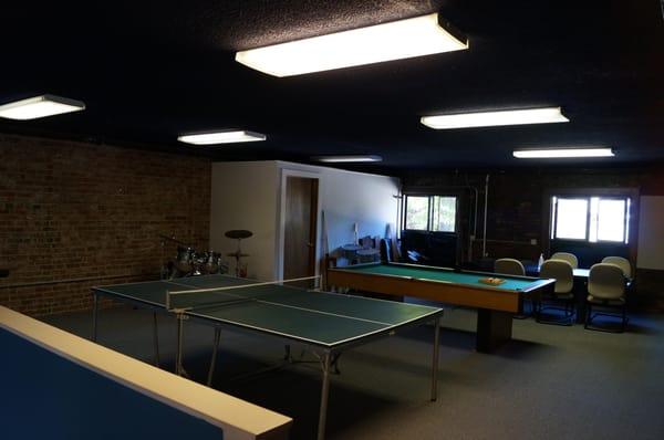 conference table area, ping pong, and pool table to keep creative thoughts flowing