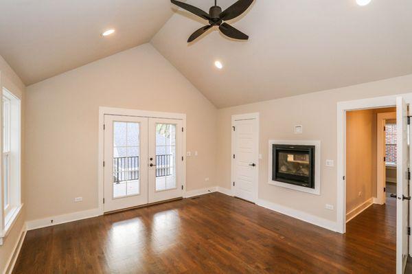 Master Bedroom with High Vaulted Ceiling Detail with Fireplace