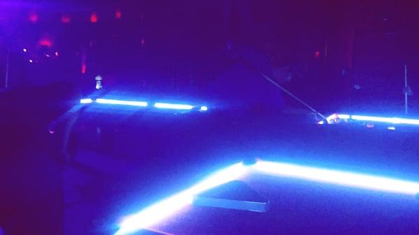 Billard tables are lit up. :)