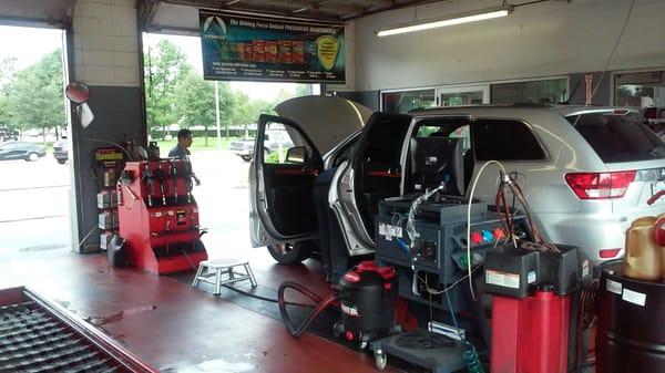 Inside the shop. Vehicle getting an oil change.