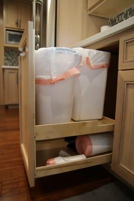 Custom trash drawer, rectangle and square trash bins Vic found for me. A sink drain cut into the corner space at an angle.