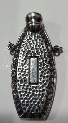 Sterling silver perfume bottle.