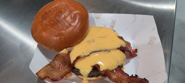 Beer Cheese, Moonshine BBQ Sauce, and Bacon on a juicy 1/2lb burger