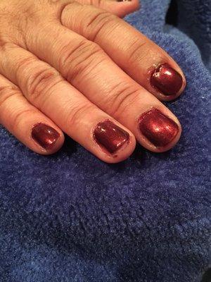 Cut my mom's finger, it was bleeding. Polish on her skin under her nails.