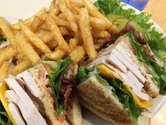 Club sandwich on sourdough. Love that carved Thanksgiving-like turkey.