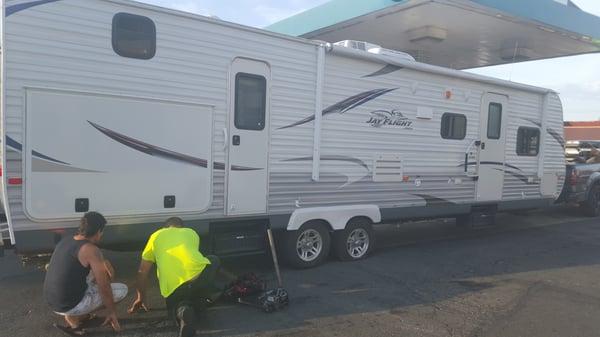 Our 32' trailer got a flat. The owner putting on a new tire in less then 30 min.