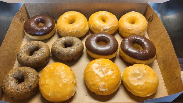 Dozen doughnuts of yeast, chocolate iced yeast, blueberry cake, raspberry filled yeast, and lemon filled yeast. Extremely light and fluffy.