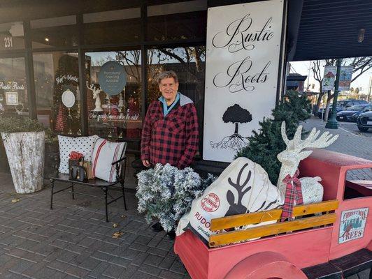 Isaac the store clerk and my husband at the entrance of "Rustic Roots"