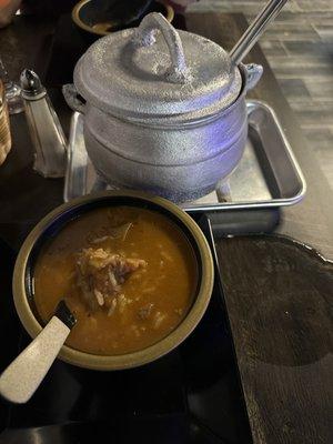 Spicy goat peanut soup for two