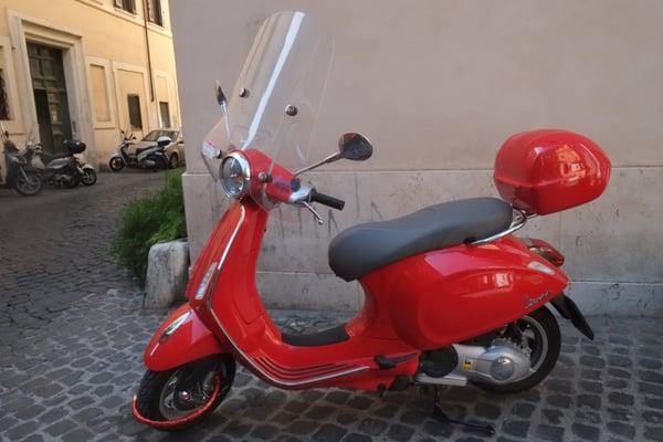 red vespa in Rome