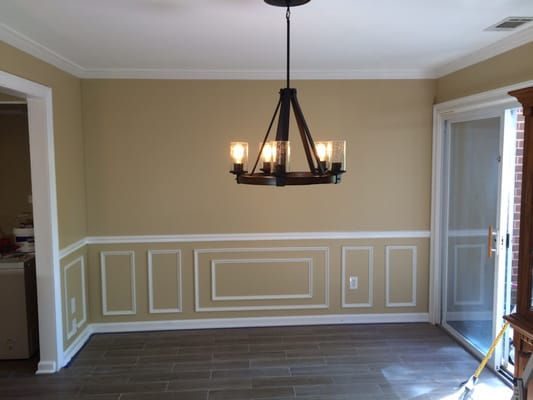 Dinning room. 1 1/2in base cap, chair rail and new lighting gave this room a entire new look!