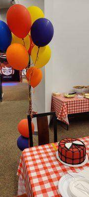 We brought a cake and some leftover balloons - they handled everything else for our pizza party!