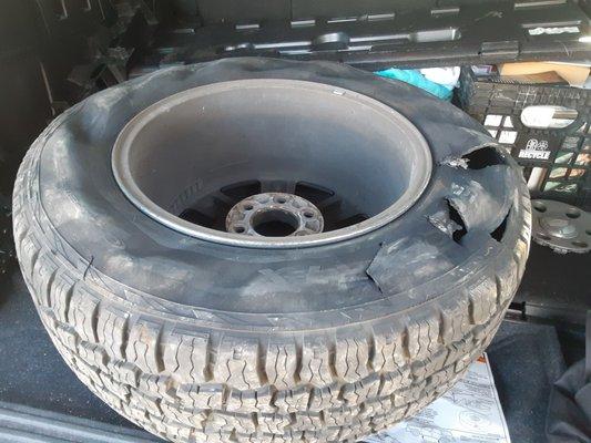 full picture of blown inside side wall tire rear passenger