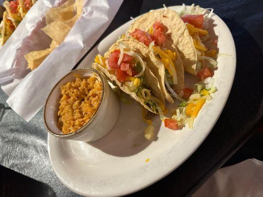 Dollar tacos with rice on the side and free chips con salsa (salsa not pictured, but it's decent)