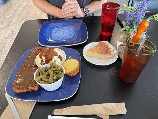 Chicken fried chicken with brown gravy, mashed potatoes, green beans, corn muffin, buttermilk pie, and iced tea.