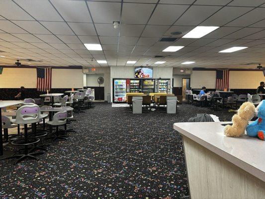 Restrooms, open space common area, and part of main check-in desk on the right of photo.