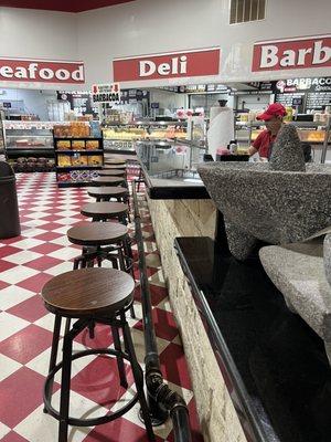 Counter across from Pan Dulce where you can watch your order to go food being made