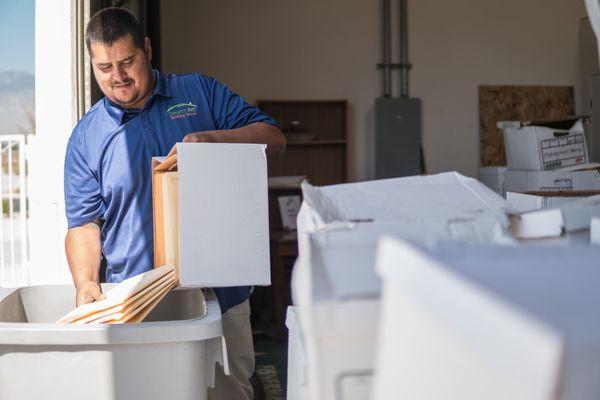 Desert Arc client shredding documents.