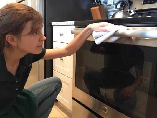 Helping a client enjoy a spotless kitchen.