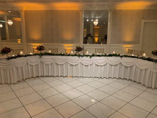 Bridesmaids bouquets repurposed for the head table.