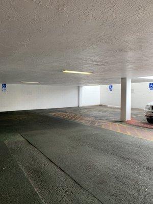 Handicapped Parking Available in Parking Garage.
 FREE Parking for customers in the 2 rows adjacent to building.