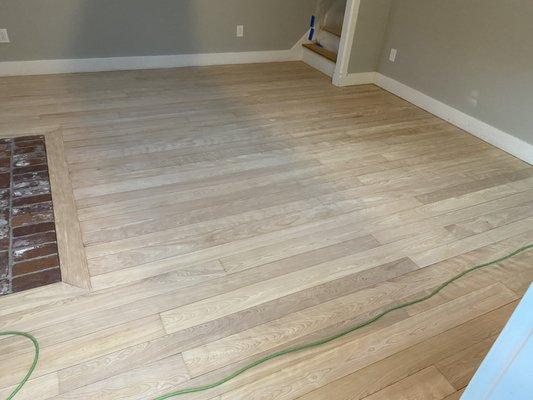 Family room floor after sanding