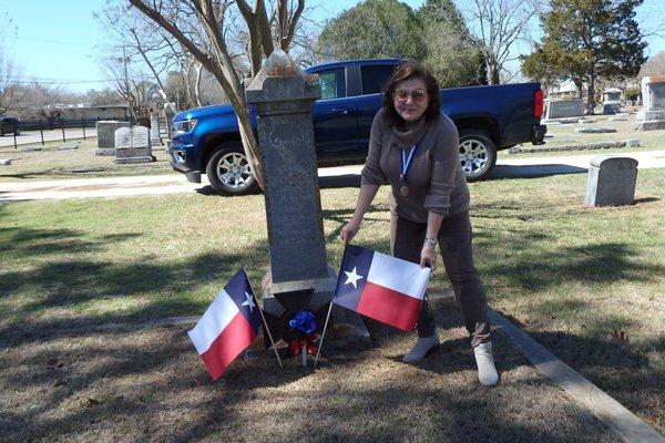 placing flags on graves of San Jacinto veterans