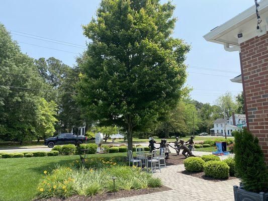 View of the front yard with tables and statue!