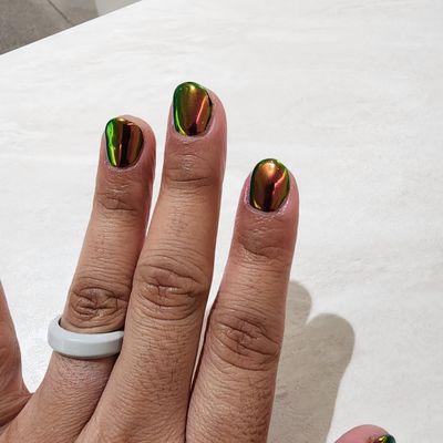 Don't know the exact color but chrome nails!