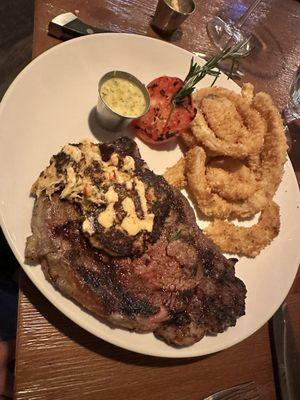 Ribeye with a crab cake and hand-battered onion rings.