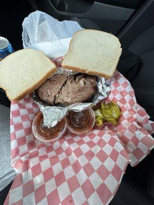 Beef brisket, bread, sauce, pickles