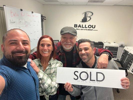 The amazing Ballou team with two very over the moon clients!