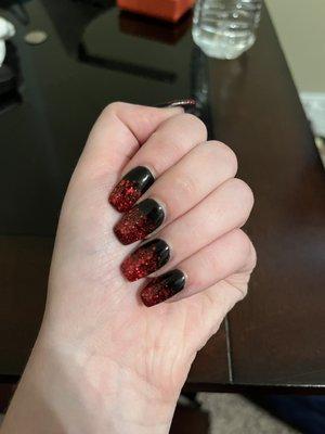 My nails, coffin nails with black dip powder and red glitter tips.