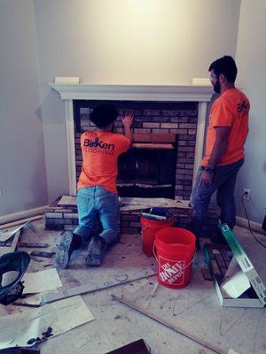 Best tile guys working on my brick fireplace!