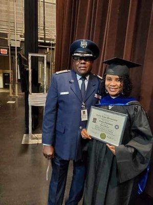 Air Force Major, Dr. Leon' Willis congratulating LLU Graduate Student Dania at the 2019 Commencement Ceremony at the Muskogee Civic Center.