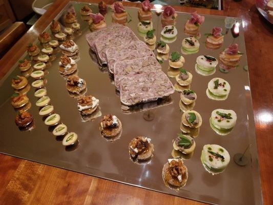 Mirror presentation of  appetizers for a Christmas Party. Country Pate and Canapes.