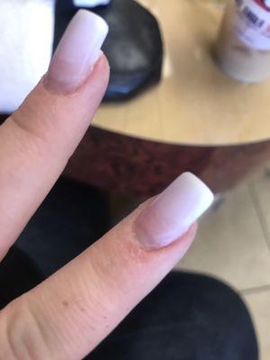 She drilled too hard on the cuticle that the pink she had applied barely showed up..