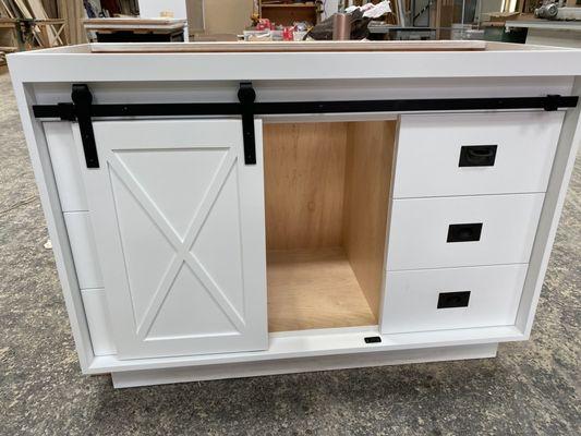 Barn door style made-to-order cabinet/storage/dresser. Can be customize to include a wine bottle rack too.