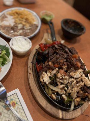 Fajitas mixed skirt steak and chicken with beans and rice