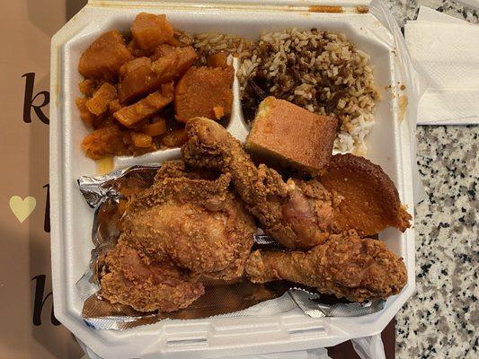 Fried chicken, candied yams, rice with gravy, and corn bread.