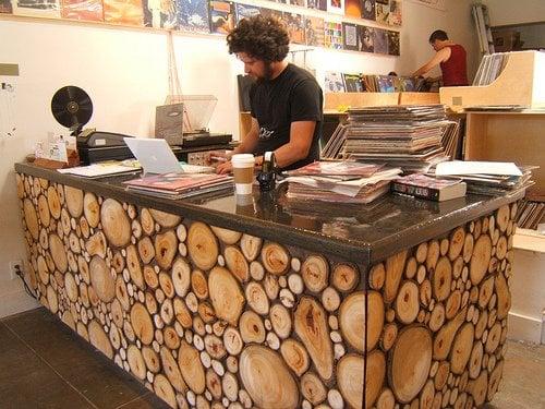 The owners built the desk and vinyl shelving themselves.