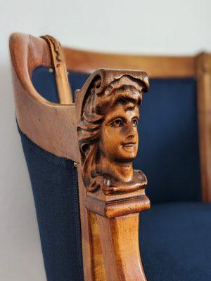 Close up detail of 1800s hand carved captains chair reupholstered by Classic House