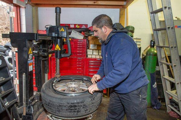 Tire installation at Safeway Oil Change & Automotive Services.