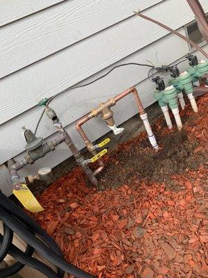 Installation of a 3/4" regulating valve to the sprinkler system.