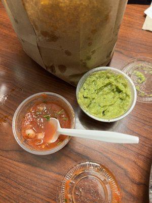 Chips and side of guac and salsa to go.