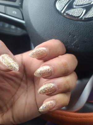 Short stiletto acrylic. With gold flakes polish.