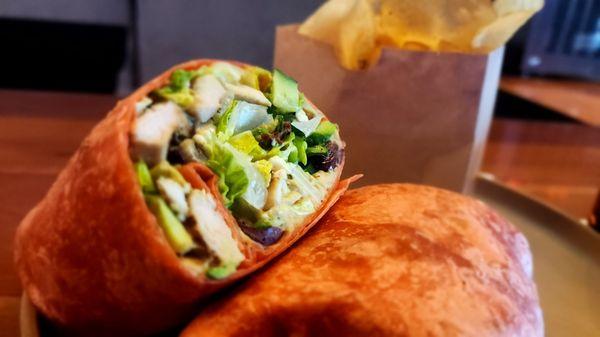 Greek Chicken Wrap - Sun dried tomato tortilla, chicken breast, romaine, olives, garlic hummus, cucumber, feta, Greek dressing