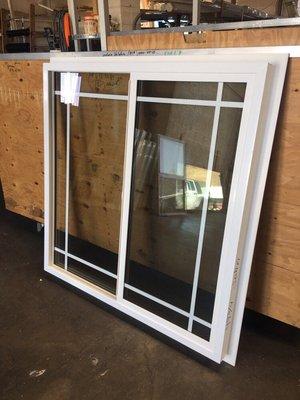 White vinyl dual-glazed retrofit frame windows are made-to-order (with or without grids)